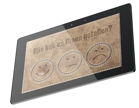 Feedbackterminal Tablet mit Bewertungssmilies auf dem Display
