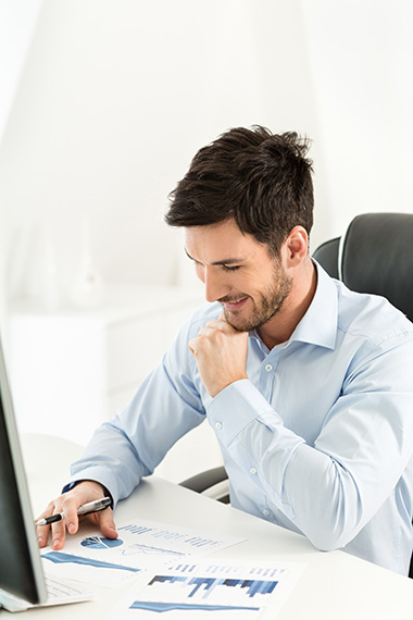 Satisfied accountant at desk