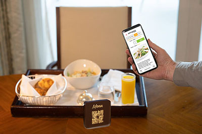 Smartphone with order app in hotel room